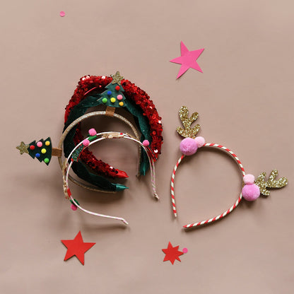 Bandeau à pompons rayés en forme de renne